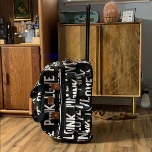 Victoria’s Secret pink wheelie duffel bag suitcase